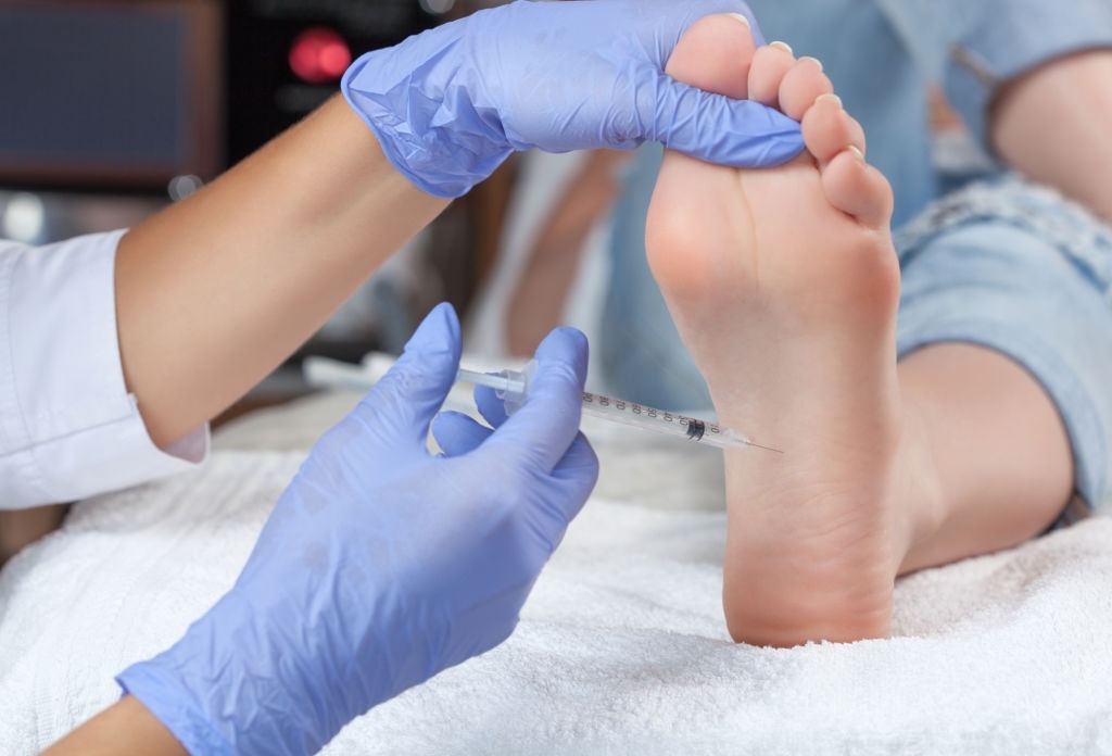 Queens Podiatrist Injecting Foot